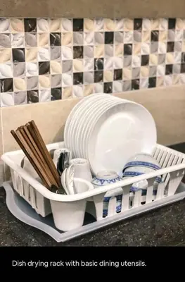 a dish drying rack with basic dining utensils at 1Pax-2Pax Single Room in Bukit Mertajam Alma Impian in Juru