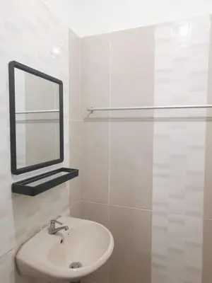 a white bathroom with a sink and a mirror at 1Pax-2Pax Single Room in Bukit Mertajam Alma Impian in Juru