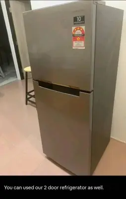 a metal refrigerator with a sign on it at 1Pax-2Pax Single Room in Bukit Mertajam Alma Impian in Juru
