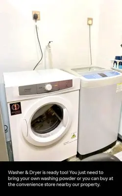 a washing machine is next to a dryer in a room at 1Pax Single Room in Bukit Mertajam Alma Impian in Juru
