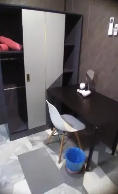 a black table and a white chair in a room at 1Pax Single Room in Bukit Mertajam Alma Impian in Juru