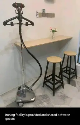 a room with a stand up microphone and two stools at 1Pax Single Room in Bukit Mertajam Alma Impian in Juru
