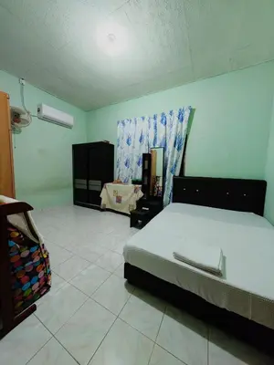 a bedroom with a bed in a room at Homestay Bendang Becah in Baling