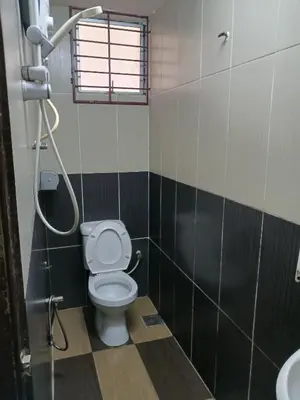 a bathroom with a toilet and a shower at Casavilla Hotel in Taiping