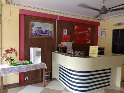 a bar in a restaurant with a counter with aperature at Casavilla Hotel in Taiping