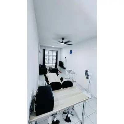 a room with two beds and a table at Ipoh Anderson Khan Residence by Khan in Ipoh