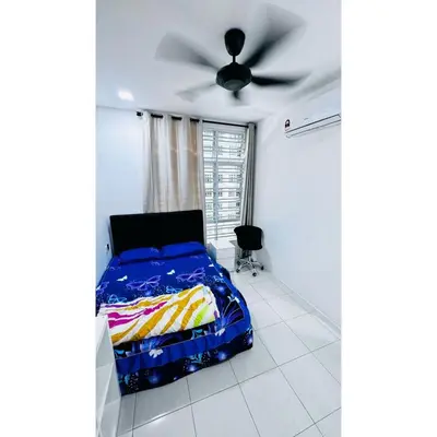 a bedroom with a bed and a ceiling fan at Ipoh Anderson Khan Residence by Khan in Ipoh