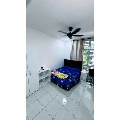 a bedroom with a bed and a ceiling fan at Ipoh Anderson Khan Residence by Khan in Ipoh