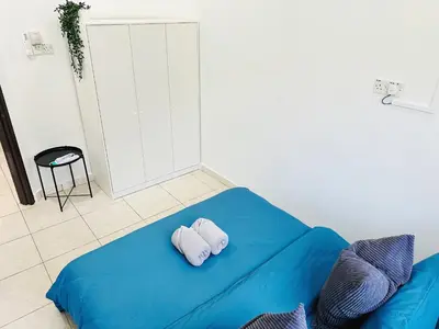two pillows on a blue bed in a room at BM\u5927\u5c71\u811a Alma Single Storey Semi-D 5-minute To Aeon Mall in Bukit Mertajam