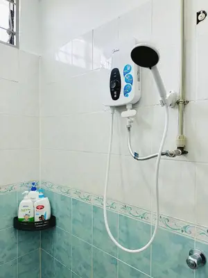 a shower in a bathroom with a blow dryer at BM\u5927\u5c71\u811a Alma Single Storey Semi-D 5-minute To Aeon Mall in Bukit Mertajam
