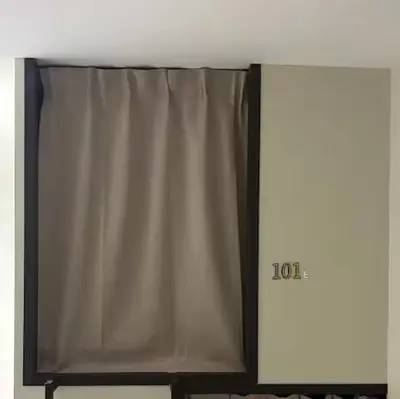 a television with a curtain on top of it at Kek Lok Si Inn in Ayer Itam
