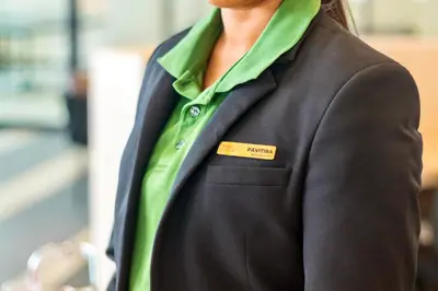 a woman wearing a black jacket and a green shirt at Marc CoLiving by Cobytat in Bukit Mertajam