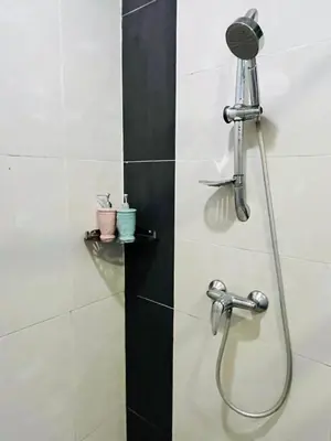 a shower with a shower head in a bathroom at Nova Sunrise & Mountain view Hilltop in Cameron Highlands in Brinchang