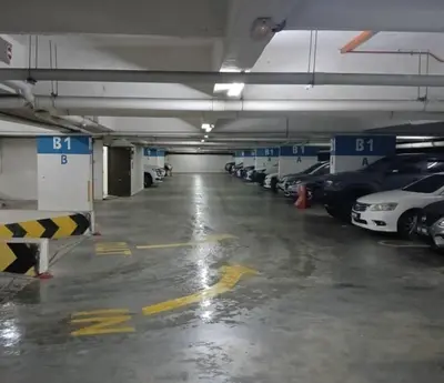 a parking garage filled with lots of parked cars at Nova Sunrise & Mountain view Hilltop in Cameron Highlands in Brinchang