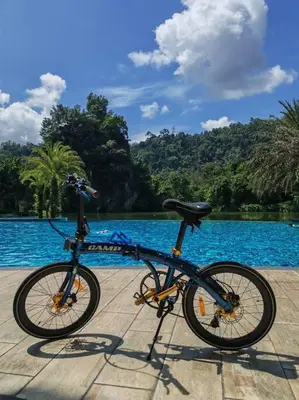 a bike parked next to a body of water at Magnificent Mountain & Lake Views' Suite Cycas in Kampong Batu Lapan