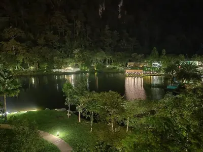 a view of a lake at night at Magnificent Mountain & Lake Views' Suite Cycas in Kampong Batu Lapan