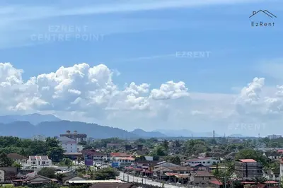 a view of a city with mountains in the background at Modern Minimalist Home Retreat near Lake Garden in Taiping
