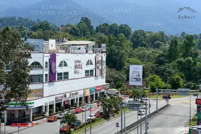 a large white building on a street with a road at Modern Minimalist Home Retreat near Lake Garden in Taiping