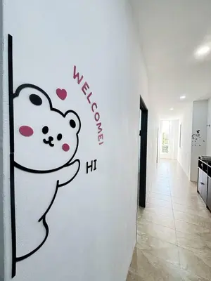 a wall with a panda bear painted on it at Trace Cozy Place in Teluk Intan