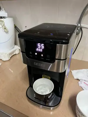a coffee maker sitting on top of a counter at Family choice Ling53 in Sitiawan
