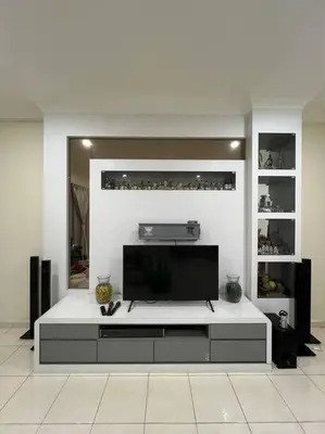 a living room with a flat screen tv on a table at Family choice Ling53 in Sitiawan