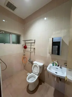 a bathroom with a toilet and a sink at Family choice Ling53 in Sitiawan
