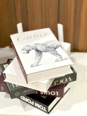 a stack of books sitting on top of a table at Mansion One Modern 5pax walking distance Gleneagles Hospital Gurney Plaza in George Town