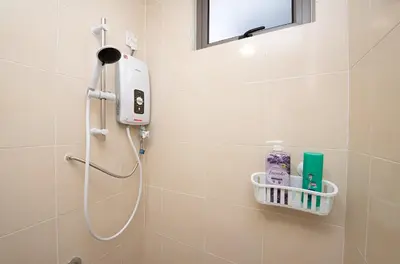 a shower in a bathroom with a shower head at Serene Zen Family Retreat 2 to 7pax&Sunrise View in Brinchang