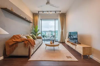 a living room with a couch and a tv at Serene Zen Family Retreat 2 to 7pax&Sunrise View in Brinchang