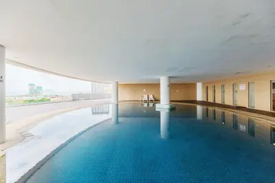a large swimming pool in a building with a view at 118 Island Plaza Penang in Tanjong Tokong