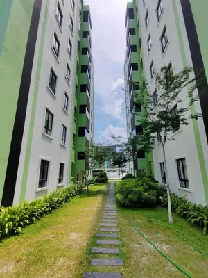 a path between two tall buildings at Manhattan Suites Ipoh in Kampong Makam