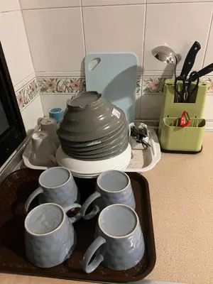 a tray filled with cups and plates on a kitchen counter at Brinchang Cameron 2R2B 10 paxs Copthorne KeaFarm #15407 in Brinchang
