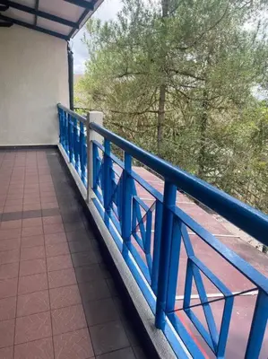 a blue railing on a balcony of a building at Brinchang Cameron 2R2B 10 paxs Copthorne KeaFarm #15407 in Brinchang