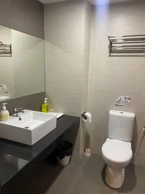 a bathroom with a white toilet and a sink at Brinchang Cameron 2R2B 10 paxs Copthorne KeaFarm #15407 in Brinchang