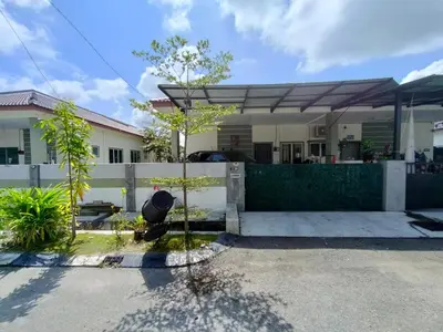 a house with a fence and a tree in front of it at Doleena's Homestay in Sitiawan