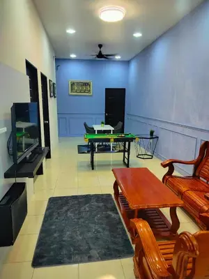 a living room with a pool table and a tv at Doleena's Homestay in Sitiawan