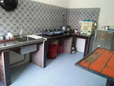 a kitchen with a sink and a counter top at M4R Homestay Gua Musang in Kampong Batu Papan
