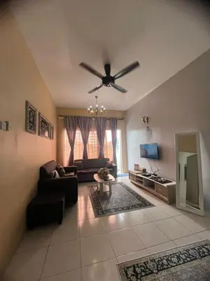 a living room with a ceiling fan and a couch at Melati Homestay Cameron Highland in Tanah Rata