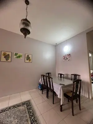a dining room with a table and chairs at Melati Homestay Cameron Highland in Tanah Rata