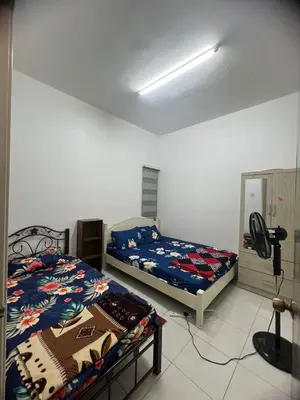 a bedroom with two beds in a room at Melati Homestay Cameron Highland in Tanah Rata
