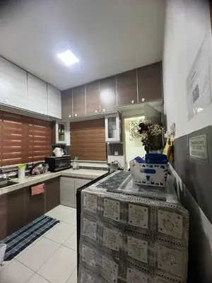 a kitchen with a island with a counter top at Melati Homestay Cameron Highland in Tanah Rata