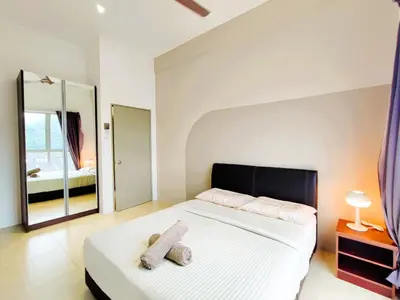 a bedroom with a bed with a teddy bear on it at Somer GoldenHills Cameron Highlands Free Wi-Fi in Brinchang