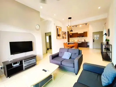 a living room with a couch and a tv at Somer GoldenHills Cameron Highlands Free Wi-Fi in Brinchang