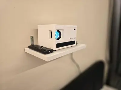 a white microwave sitting on a shelf on a wall at Helena Homes - Premium Cozy Ipoh Homestay in Kampong Simee