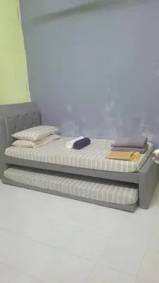 two mattresses on a platform in a room at Ummi Homestay in Kampong Batu Tiga