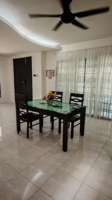 a dining room table with two chairs and a ceiling fan at 23 Inn Queenbed Room with share bathroom in Simpang Ampat