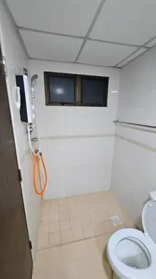 a bathroom with a toilet and a phone on the wall at Near USM 6 pax, 2 Bedroom w Aircond, 2 toilet, 5G WIFI in Si Dua Besar