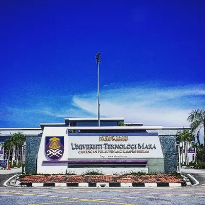 a large building with a sign in front of it at Homestay Coway Bertam in Kampong Sungai Korok
