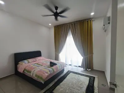 a bedroom with a bed and a ceiling fan at Homestay Coway Bertam in Kampong Sungai Korok
