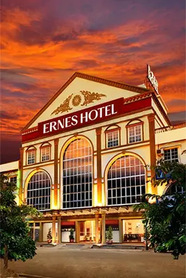 a building with a sign on the side of it at ERNES Hotel Bandar Perda in Kampong Permatang Batu